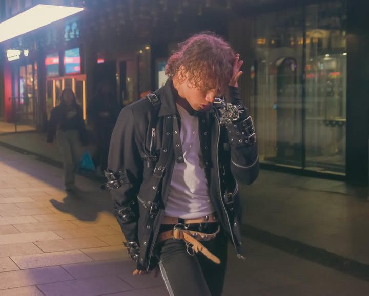 Addison Wonderland Michael Jackson BAD-era performer in a buckled jacket on a London street at night
